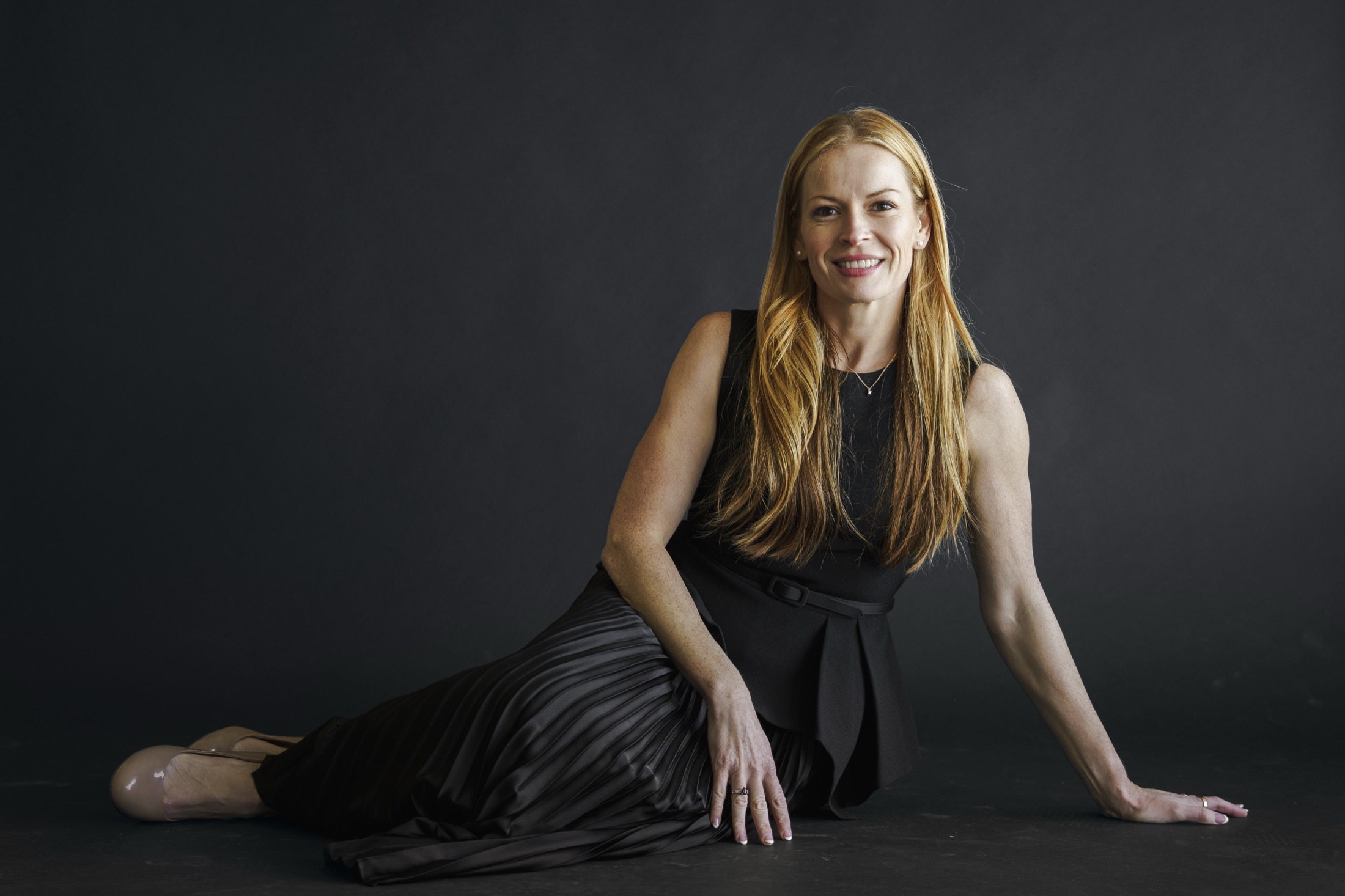 Steph Lombardo, operator and AI systems builder, in a studio portrait